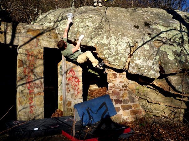 Adam Walker on "DoorWay" (V-4+) at the roadside boulder, bluefield boulders.<br>