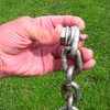 This was one of the anchor bolts!  When taking into account the washers and chain, the stud was in the stone about 1/2".  However I am sure the silicon had some adhesive value:)<br>
<br>
The anchor has been replaced courtesy of ASCA.
