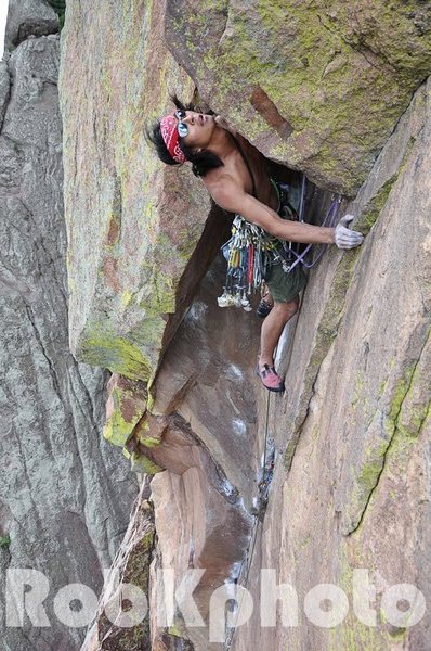 Nick Chan coming out of the bombay chimney on the Naked Edge 5.11b