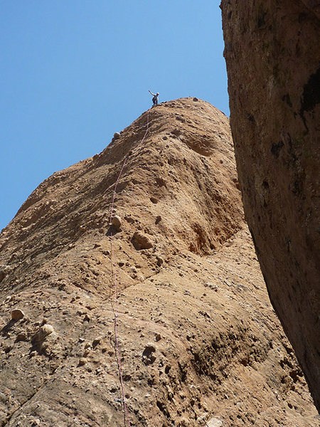 Spider on Tethys at the last bolt before belay at top. Proving the route can be done as one pitch with a 60 meter rope. Photo by D. Blattel, 2010.