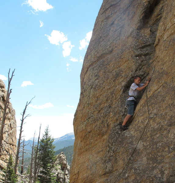 SamRob, 10, clips the 2nd bolt on his first lead climb.
