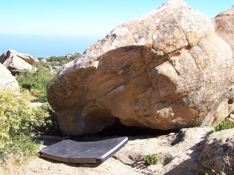 Emergency Response, V4. Start hold is the big chalked one above the right edge of the pad. Top out in the vicinity of the seam that is perpendicular to the starting hold edge.