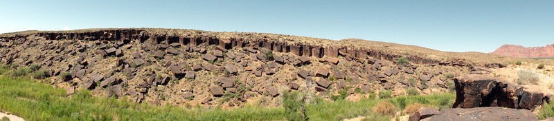A panoramic shot of the cliff band across the river (viewed from the parking area). These climbs are short, about 20-35 feet. It gets sun in the morning and shade in the afternoon.