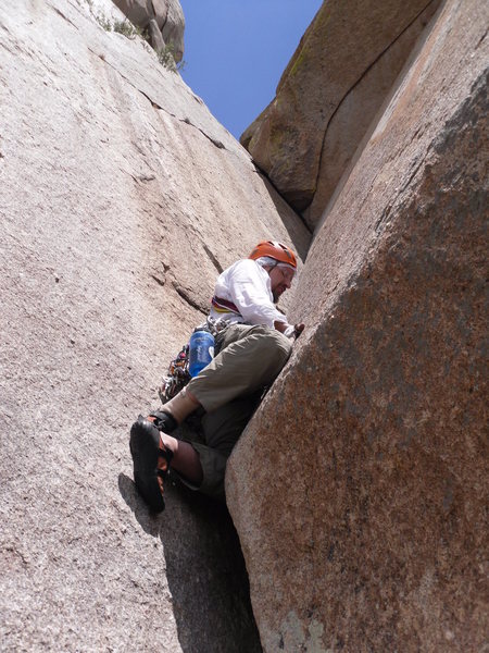 Clearing the first roof of pitch 3 (Karl's Korner).