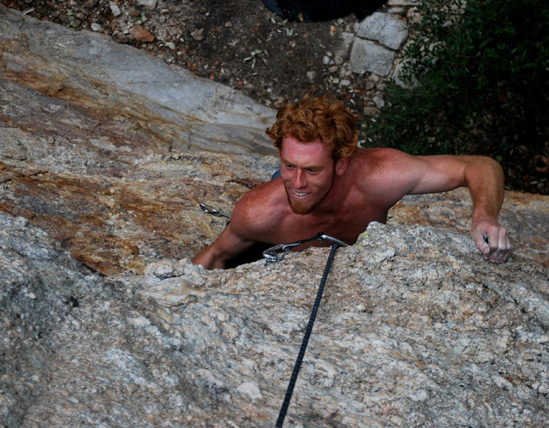 Red at the last bulge; looking happy he found the good hold! Wrong route: Rayzor's Edge is the name. Ooops.