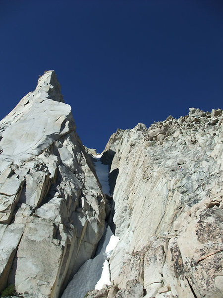 Vincent downclimbing the prow to the right of the gully to reach the base of the route.