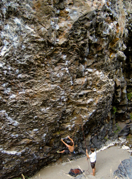 John working the routes lower crux