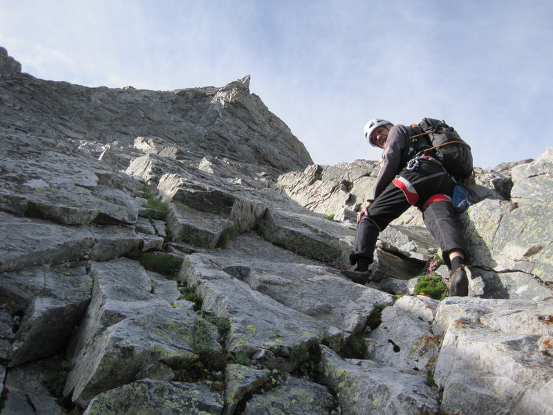 Roland heading up the 4th class ramp to get around to the right of Unicorn Pinnacle.