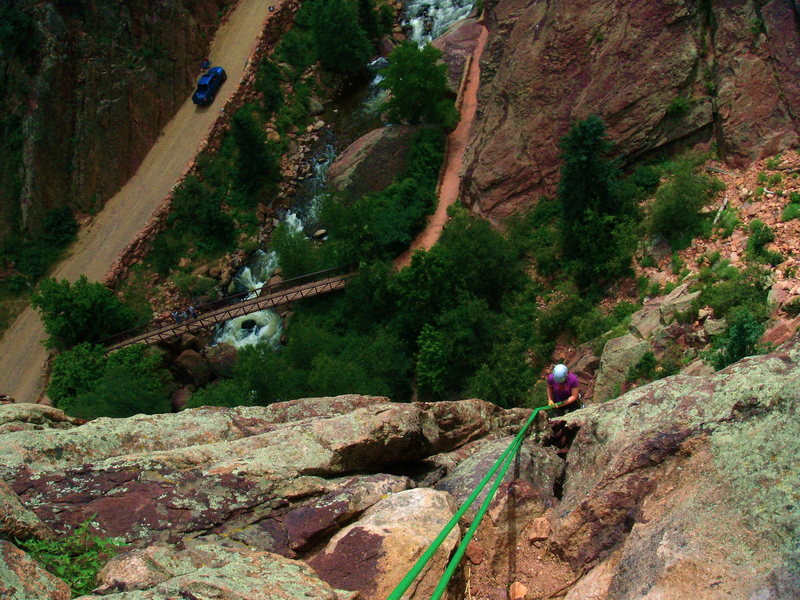 Lynette rappelling down from the wind tower in Eldorado Canyon, CO.