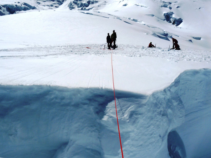 My look across the "practice crevasse" - I punched through the left side of this crevasse about 30 minutes later on a snow bridge that other people walked over unroped -- happy for my rope team, Dima and John