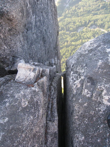 The final squeeze chimney to the summit, awkward finish to a long day!