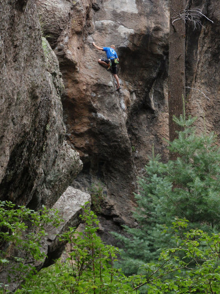 Kenton making the thin crux moves onto the slab.