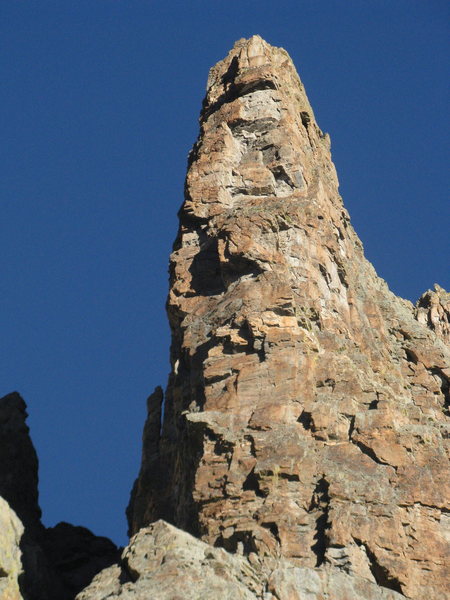 The route is in the shade just left of the sun/shade border. The "pocketknife flake" is visible down low and left in the shade.