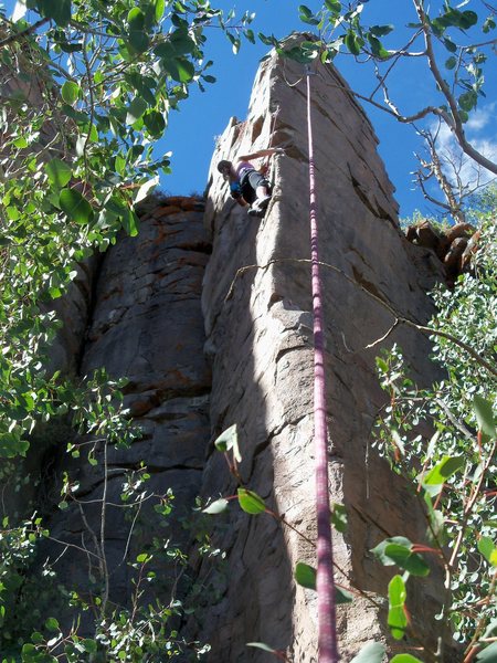 Contemplating the crux moves to reach the anchor.