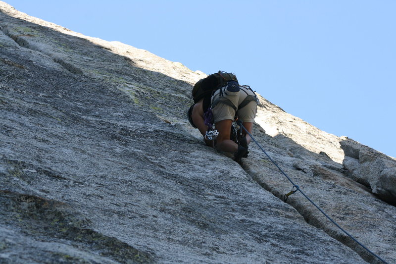 Agina into the fun crack climbing of pitch two.