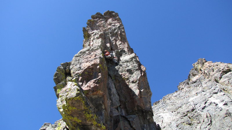 Pitch 5.<br>
Up cracks, when they end move left around the corner and up to summit.