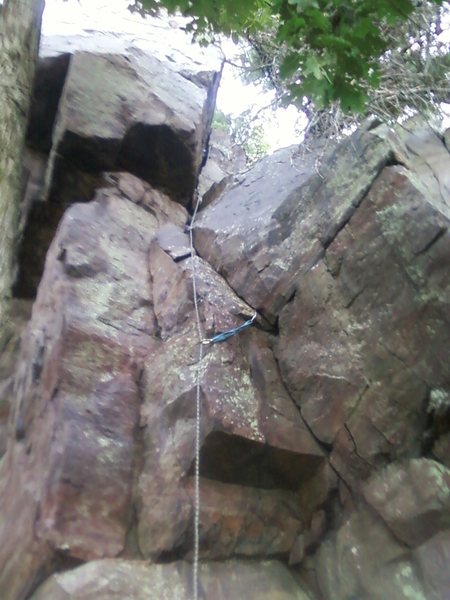 Follow the rope line. I led it and finished on the south face. The west face has no pro but is a good TR.