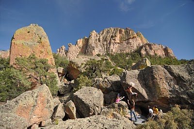 Crux move of Velcro Kitty. The Warm Up Solo is visible on the large boulder to the left