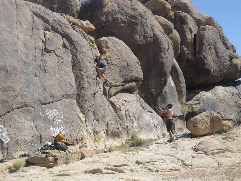 Carlo Rivas climbing Mickey's Easy Corner(5.2 variation) on TR, Ghost Boulders, Johnson Valley Area.