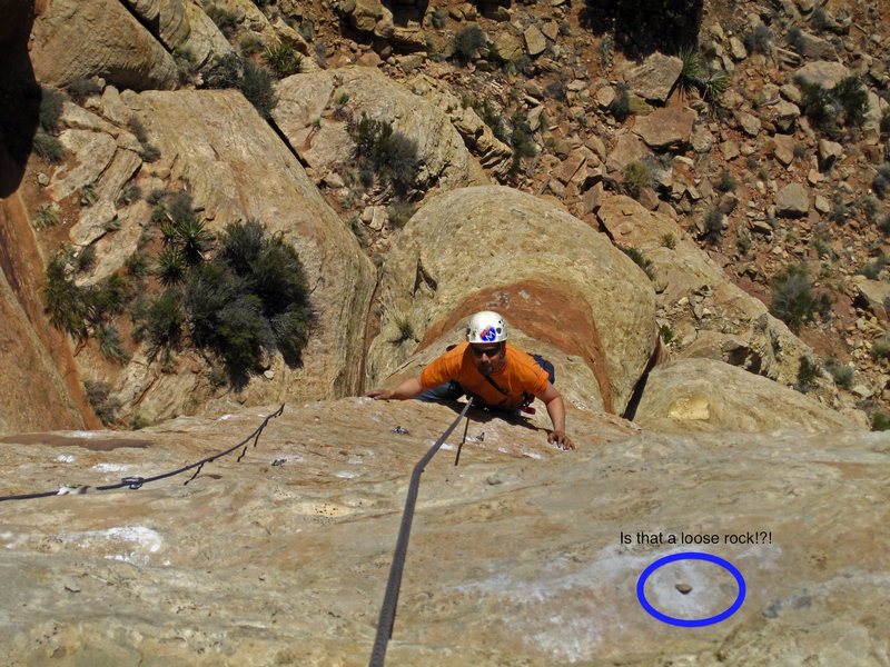 I would like everyone to be aware of the loose rock danger on Desert Siren, as shown in this photo. Brad you are a brave man! Good call on the helmet!