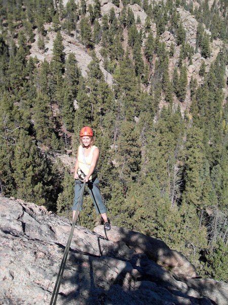 Brenda raps off the big pine tree on the back of the dome. It's a fun descent. As of Sept 2010, there were two good slings on the tree, and I added a rap ring to save the slings.