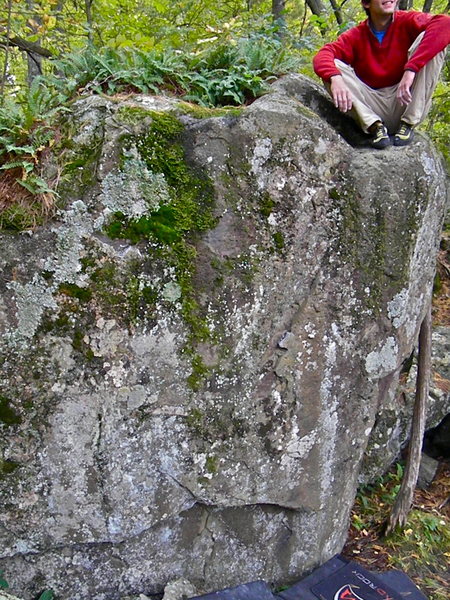 Hey, wondering if anyone would be willing to add info about this problem. It is located towards the river from the cave. Short but cool.