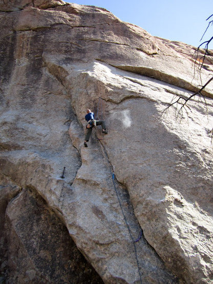 Brandon is at the first bolt (with three cam placements below). Photo by Glenn Schuler.
