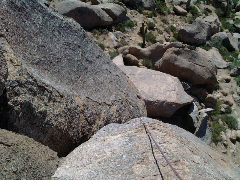 This view looks down to the top of the first off-width from the base of the second off-width, with the rope showing the general line.