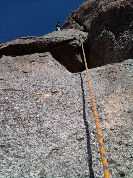 In this picture, the first off-width section can clearly be seen, with Cory belaying from the top of the second off-width, which cannot be seen here.