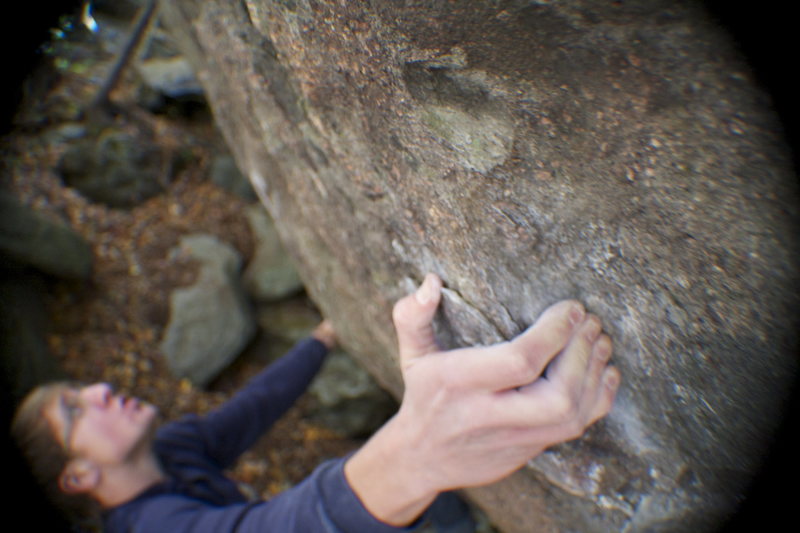 Nick Love taking a deep breathe before the crux big move on Shang-High Knights(V6)