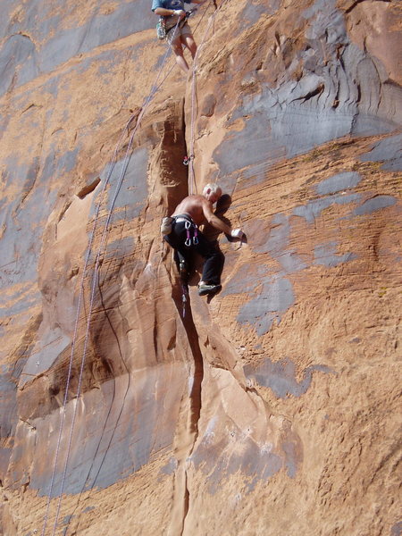 Steve Arsenault finishing the upper crux. Brian Delaney belaying.