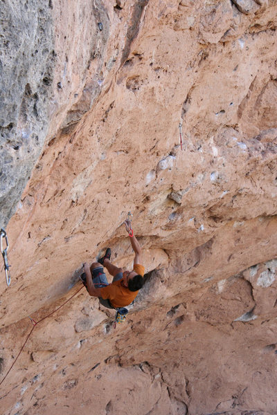 Setting up for the climactic dyno at the end of the hard climbing. Photo by Matt Moore