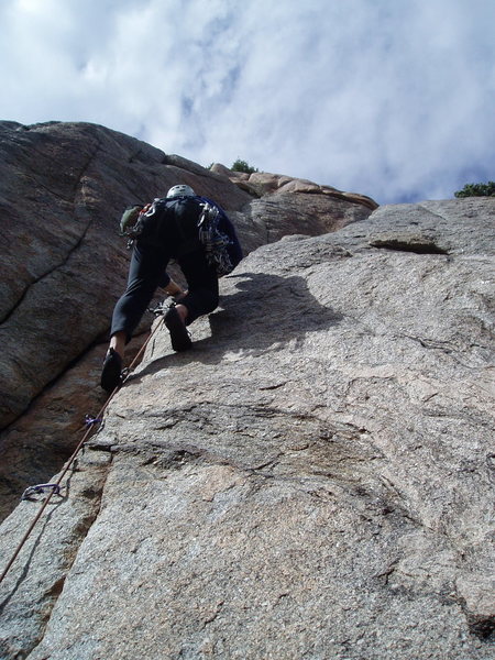 Kenny above the short but difficult P2 crux.
