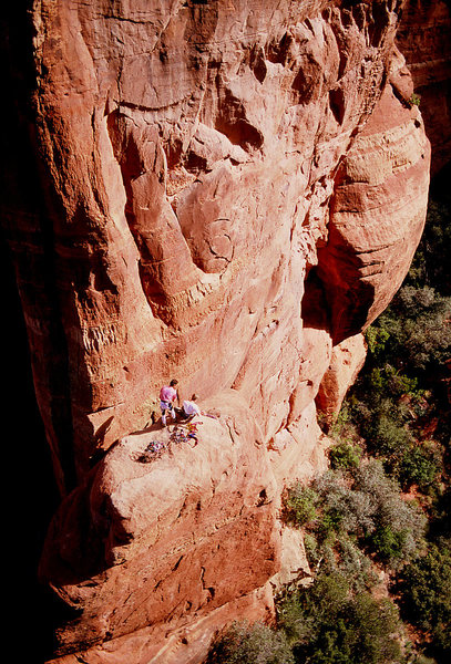 Scott Baxter and Al Doty on the ledge at the end of the first pitch. The poorly protected face climbing leads off the ledge to the obvious, bottomless corner above.