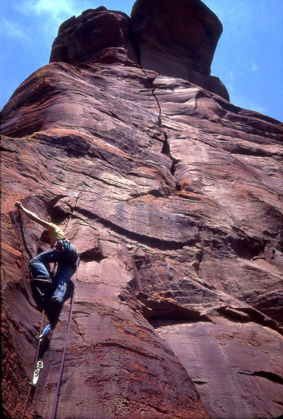 Jim Haisley on the lower section of pitch 2- he has surmounted the thin face start, and is in the better protected thin crack. The blank plaque above is where two aid moves were required to move right.
