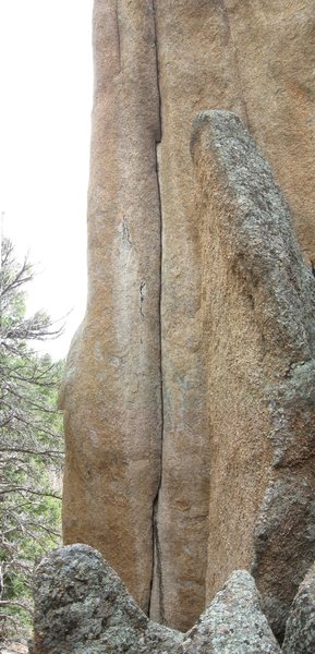 The sweet looking, thin crack about 15 feet right of Soft Parade. I only ask that nobody bolt it or nail it; it looks wide enough to be doable (barely) by the very strong. Notice the stitch-together seam at about 1/3 height. The first pod is tight hands (about 0#.75 Camalot), so judge accordingly.