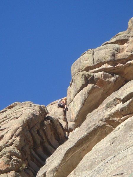 Dave Wayne in the crux of the 5.8 variation the the second pitch.