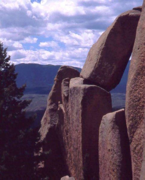 The top of the chimney is visible under the caprock. The north exit ledge is visible.