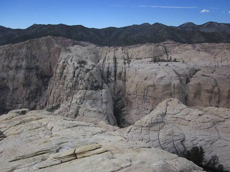 Looking back at the approach from Rocky Gap. The standard route follows the neck of rock.
