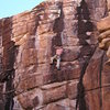 Dave M. on the juggy Black Ape. Climbing in the shade with no shirt in November, gotta love Colorado.