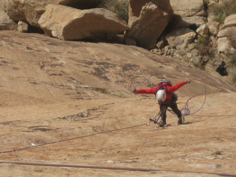 Paul doing strange rope manipulations on the hanging belay of P2 !. Photo Lance Bateman