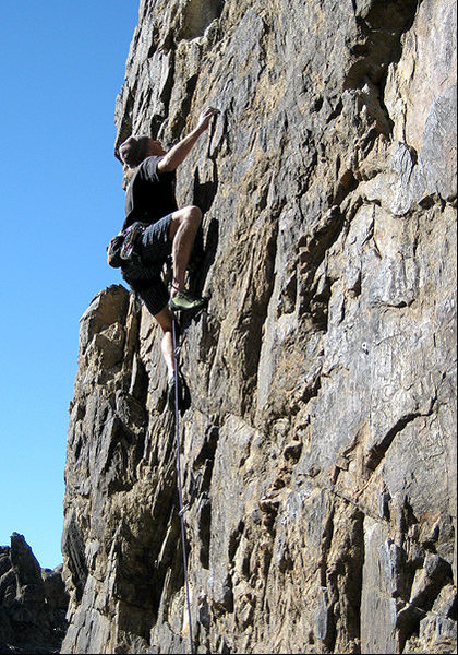 Erik on the first crux of "Candy-O".<br>
Photo by Blitzo.