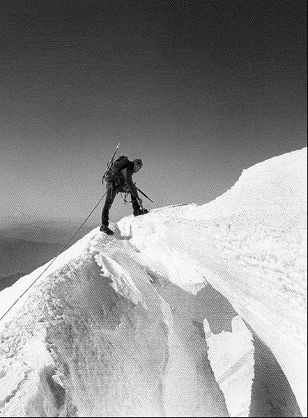 Errett Allen crossing a snow bridge on Mt. St. Helens, 1974. The bridge collapsed just after I crossed it.