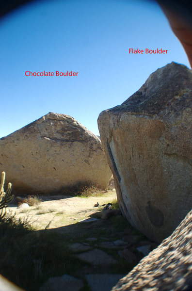 Flake boulder in contrast with West face of Chocolate boulder, looking at ScimitarV6.