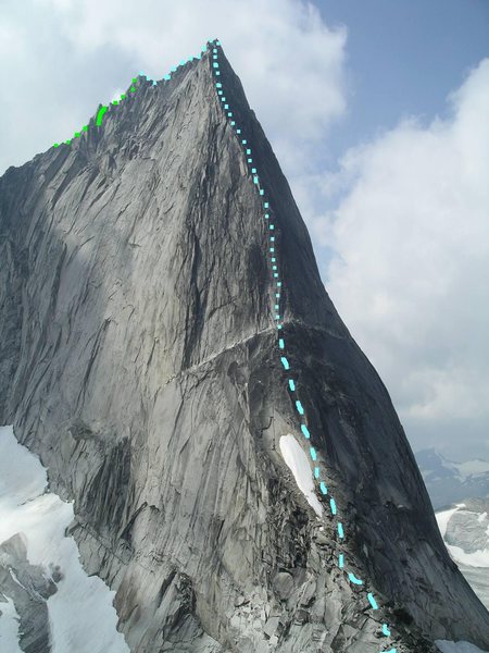 Northeast Ridge, Bugaboo Spire<br>
Photo by MP contributor Steven Lucarelli<br>
<br>
Blue dashes - Approach<br>
Blue squares - Northeast Ridge<br>
Green - Kain Route<br>
Green line - Great Gendarme Rappel