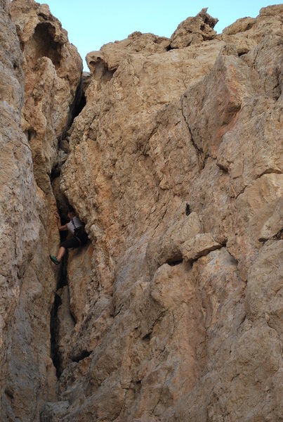 Reni pulling out the pro I placed at the chockstone. The chockstone is just above her.