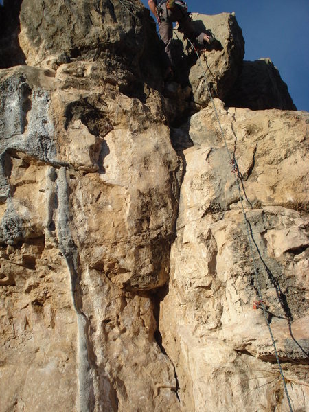 From the anchor bolts at the top, setting up a top rope for the problem next to it. Follow the rope to see where the bolts are.