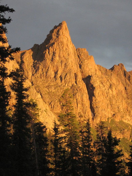 West face from upper Noname drainage at sunset. We saw noone in this entire drainage the entire time.<br>
<br>
The 5.10 heads up this side. The normal route heads up grassy ledges to the lefthand notch then around the backside.