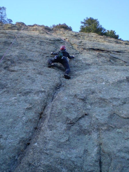 Deb Thompson on Just One Tick Away. The line actually continues straight up, not where the rope angles left to the directional ~50 feet above her.