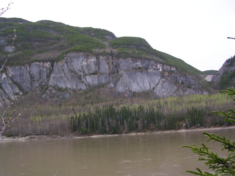 Liard River and big limestone a few miles upstream from the Liard Hot Springs.
